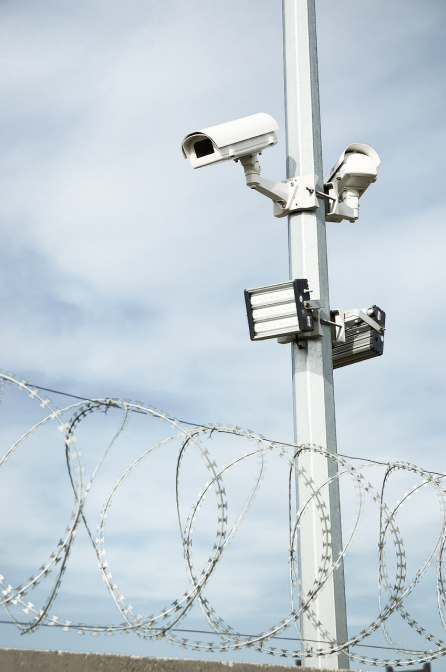 Security camera PIDS with lights and a security fence